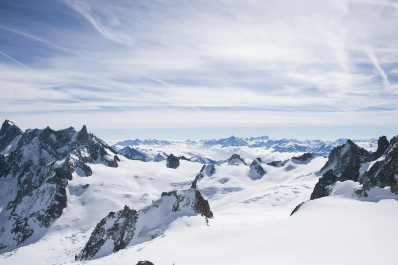 a man riding skis down a snow covered slope, an album cover, pexels contest winner, 4 k cinematic panoramic view, chamonix, view from high, glaciers