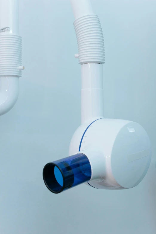 a couple of pipes that are connected to a wall, unsplash, conceptual art, dentist, white cyan, close up camera angle, white