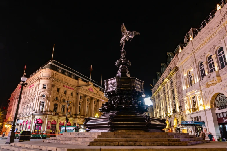 a statue in the middle of a city at night, victorian london, fan favorite, square, image