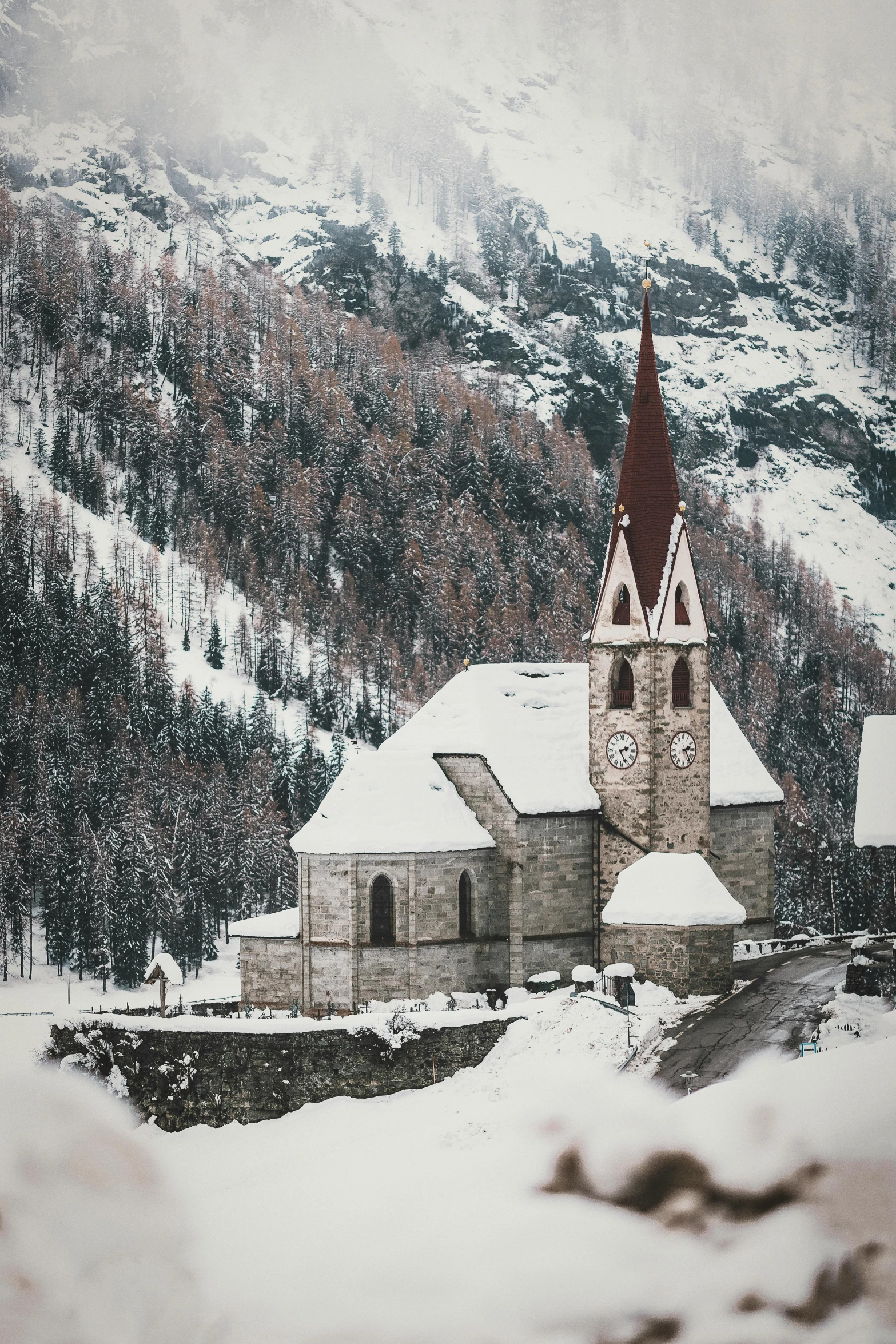 a church in the middle of a snowy mountain, pexels contest winner, romanesque, vintage color photo, grey, holiday, lush surroundings