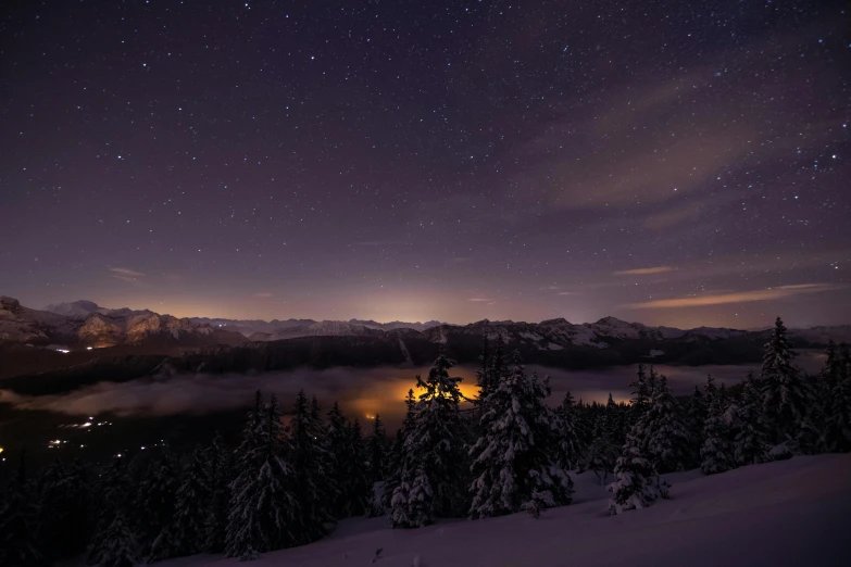 a view from the top of a mountain at night, by Sebastian Spreng, winter lake setting, overlooking a valley, winter photograph, desktop wallpaper