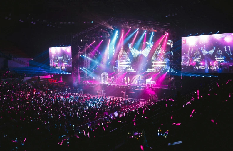 a large crowd of people at a concert, by Robbie Trevino, pexels contest winner, maximalism, pink and blue lighting, in an arena, kpop, full room view