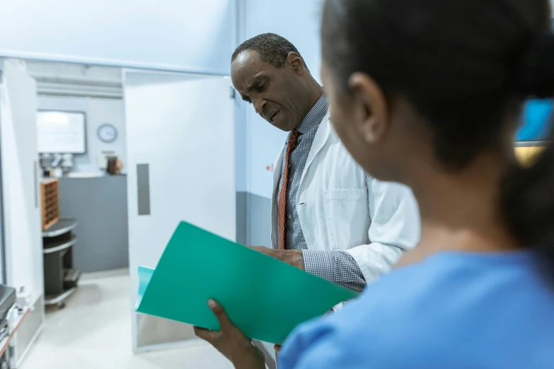 a man standing next to a woman holding a folder, happening, anaesthetic, profile image, digital image, wide shot photograph