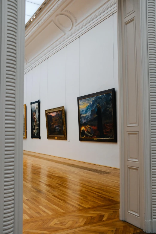 a room with a lot of paintings on the walls, inspired by Joaquín Sorolla, visual art, calatrava, doorways, high-quality photo, trending photo