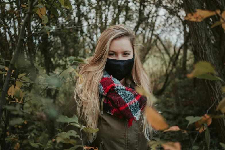 a woman wearing a face mask in the woods, by Emma Andijewska, pexels, wearing fluffy black scarf, beautiful blonde girl, neoprene, avatar image