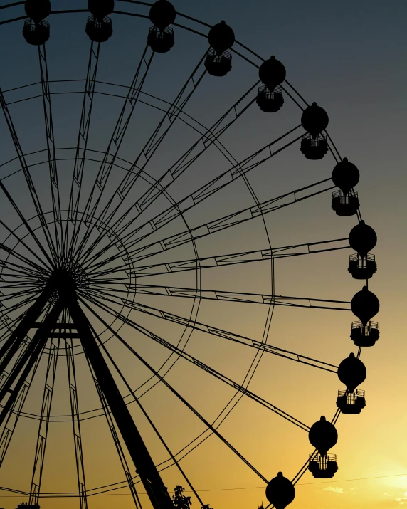 a ferris wheel is silhouetted against the setting sun, pexels contest winner, romanticism, portrait mode photo, ilustration, f/3.2, stacked image