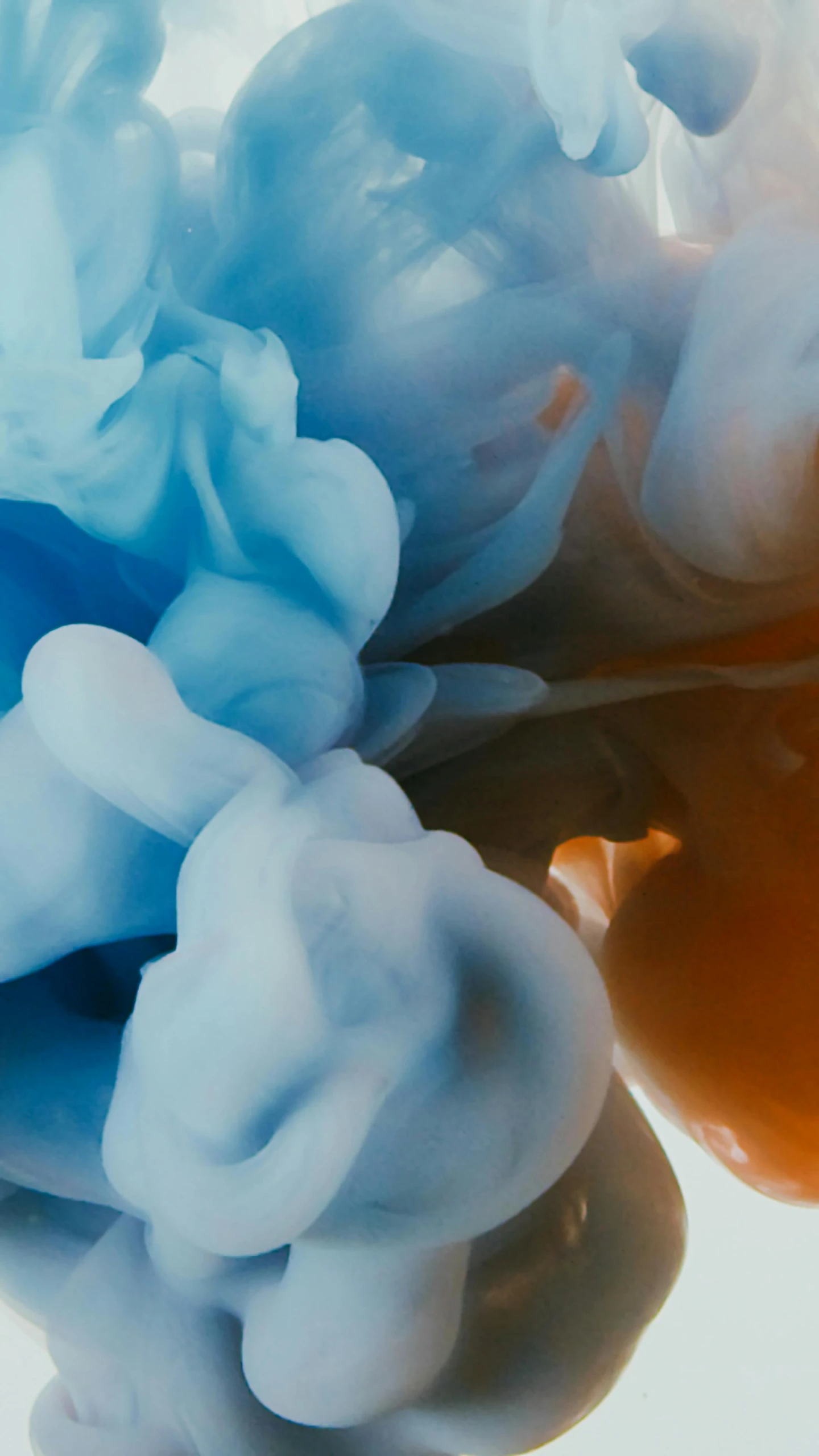 a close up of a blue and orange substance, inspired by Alberto Seveso, unsplash contest winner, roses made of colorful smoke, brushed white and blue paint, in 4k, lo - fi colors