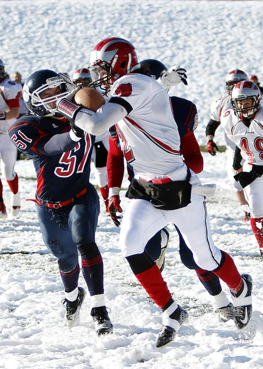 a group of young men playing a game of football, a digital rendering, by Paul Davis, pexels contest winner, high snow, red horns, freeze frame, navy