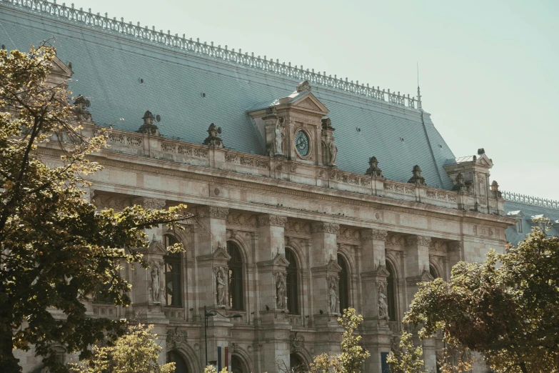 a large building with a clock on top of it, pexels contest winner, paris school, palace of the chalice, over the shoulder, adelaide labille - guiard, exterior shot