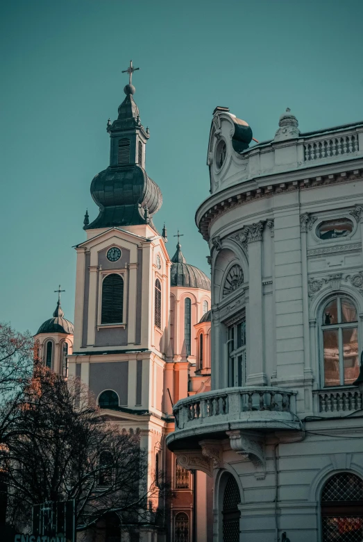 a large white building with a clock tower, by Bertalan Székely, pexels contest winner, baroque, two organic looking towers, red building, churches, neoclassical tower with dome