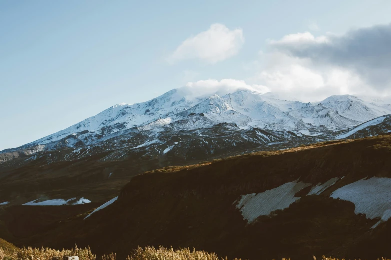 a man flying a kite on top of a snow covered mountain, an album cover, trending on unsplash, hurufiyya, new zealand landscape, hq 4k phone wallpaper, craters, slightly pixelated