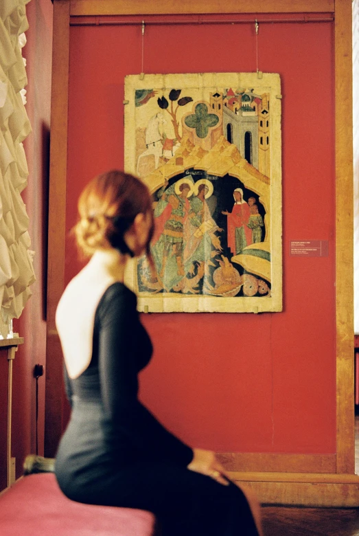 a woman sitting on a stool in front of a painting, a detailed painting, by Andrei Rublev, medium shot taken from behind, orthodox icon, romance, 15081959 21121991 01012000 4k