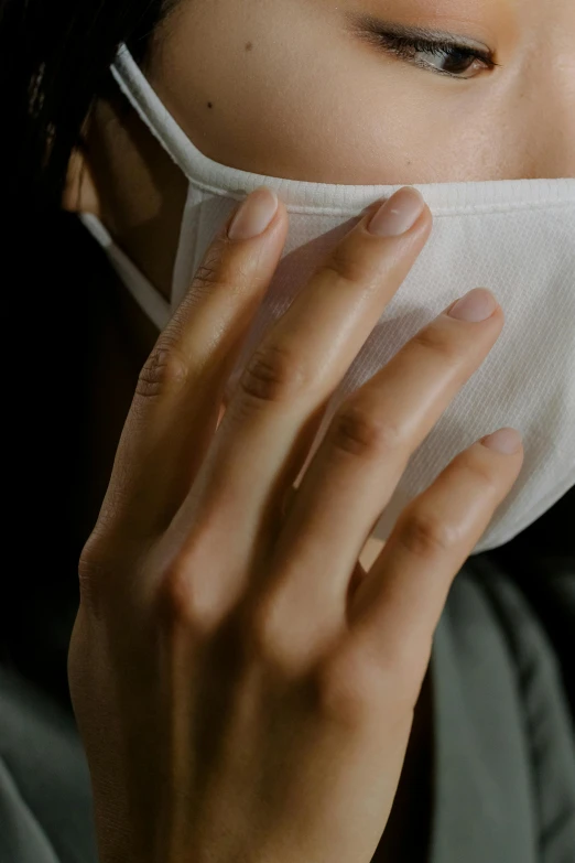a close up of a person wearing a face mask, delicate fingers, wearing a light shirt, ad image, slide show