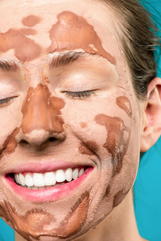 a close up of a person with chocolate on their face, smiling maniacally, skincare, brilliantly coloured, covered in