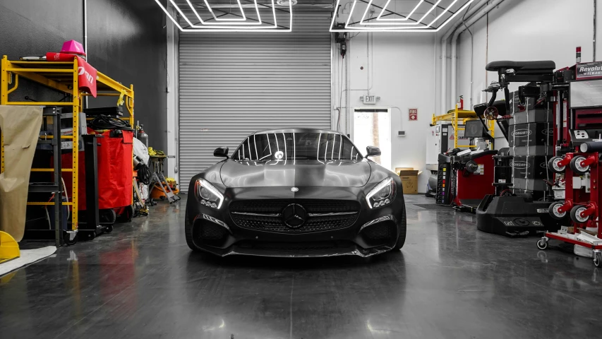a black and white photo of a car in a garage, galaxy raytracing, samurai vinyl wrap, mercedez benz, professionally color graded