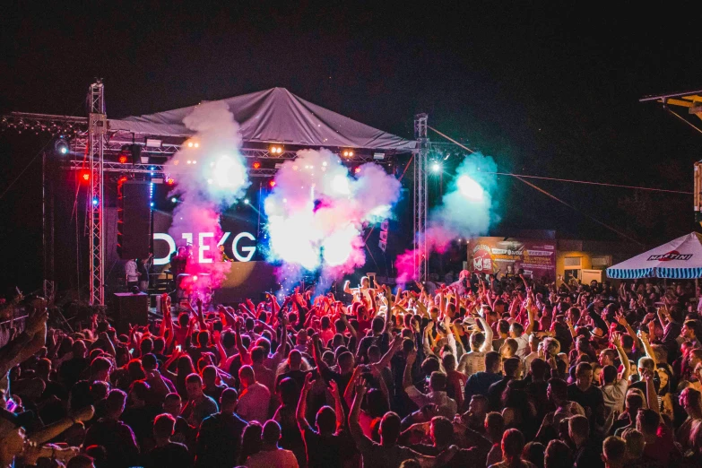 a large crowd of people at a music festival, by Niko Henrichon, happening, edge glow, diego fernandez, marquee, full of colour