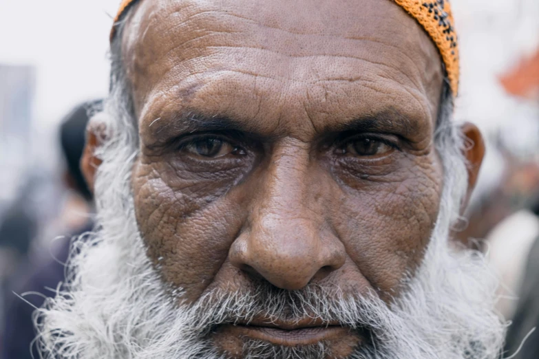 a close up of a person with a beard, pexels contest winner, mogul khan, heavy - lidded eyes, portrait of a old, ground - level medium shot