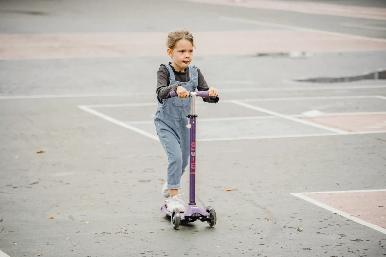 a little girl riding a scooter in a parking lot, a picture, inspired by Violet Oakley, pexels contest winner, medium height, slate, metallic, greta thunberg