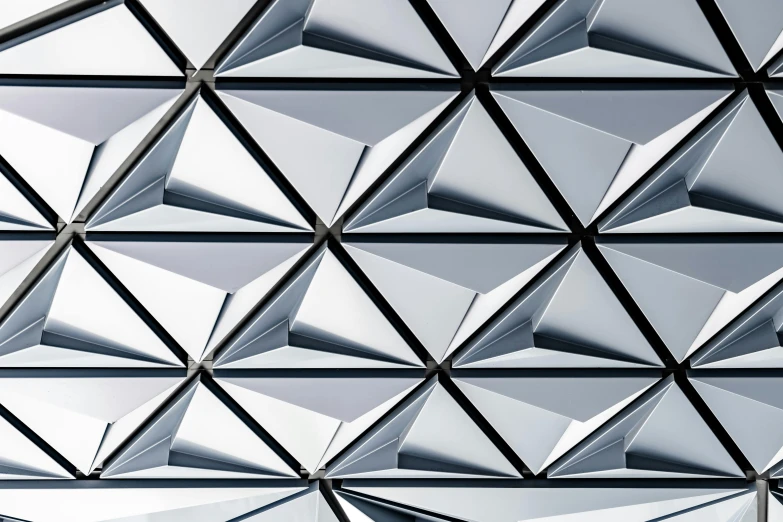 a close up of the roof of a building, inspired by Buckminster Fuller, unsplash contest winner, crystal cubism, flat triangles, silver background, parametric solid works, canopies