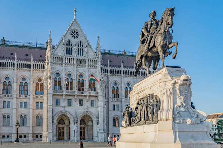 a statue of a man on a horse in front of a building, gothic architecture, featuring marble fountains, parliament, group photo