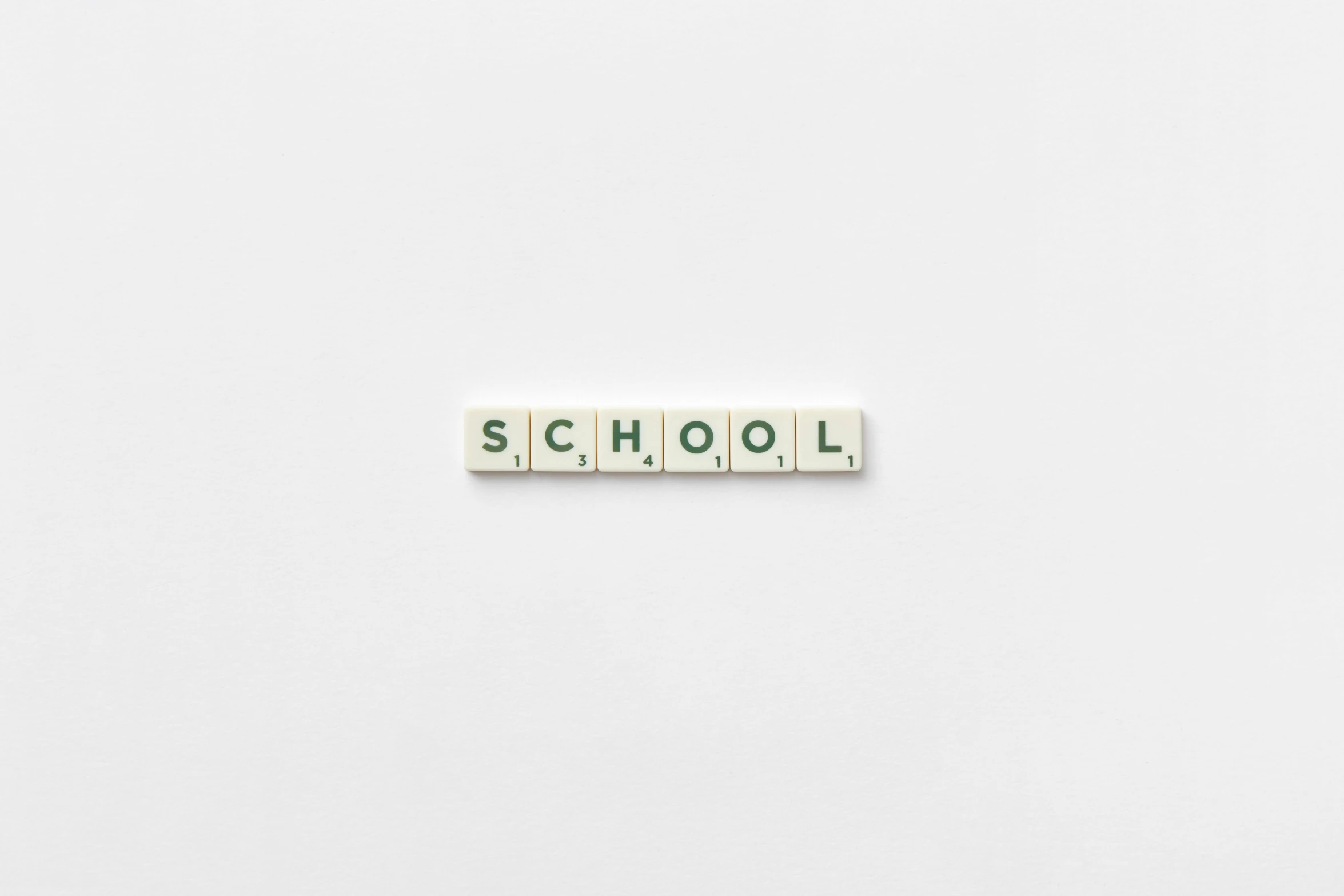 the word school spelled in scrabbles on a white surface, by Emma Andijewska, minimalist photorealist, wetastudiofx, 1 2 9 7, icon