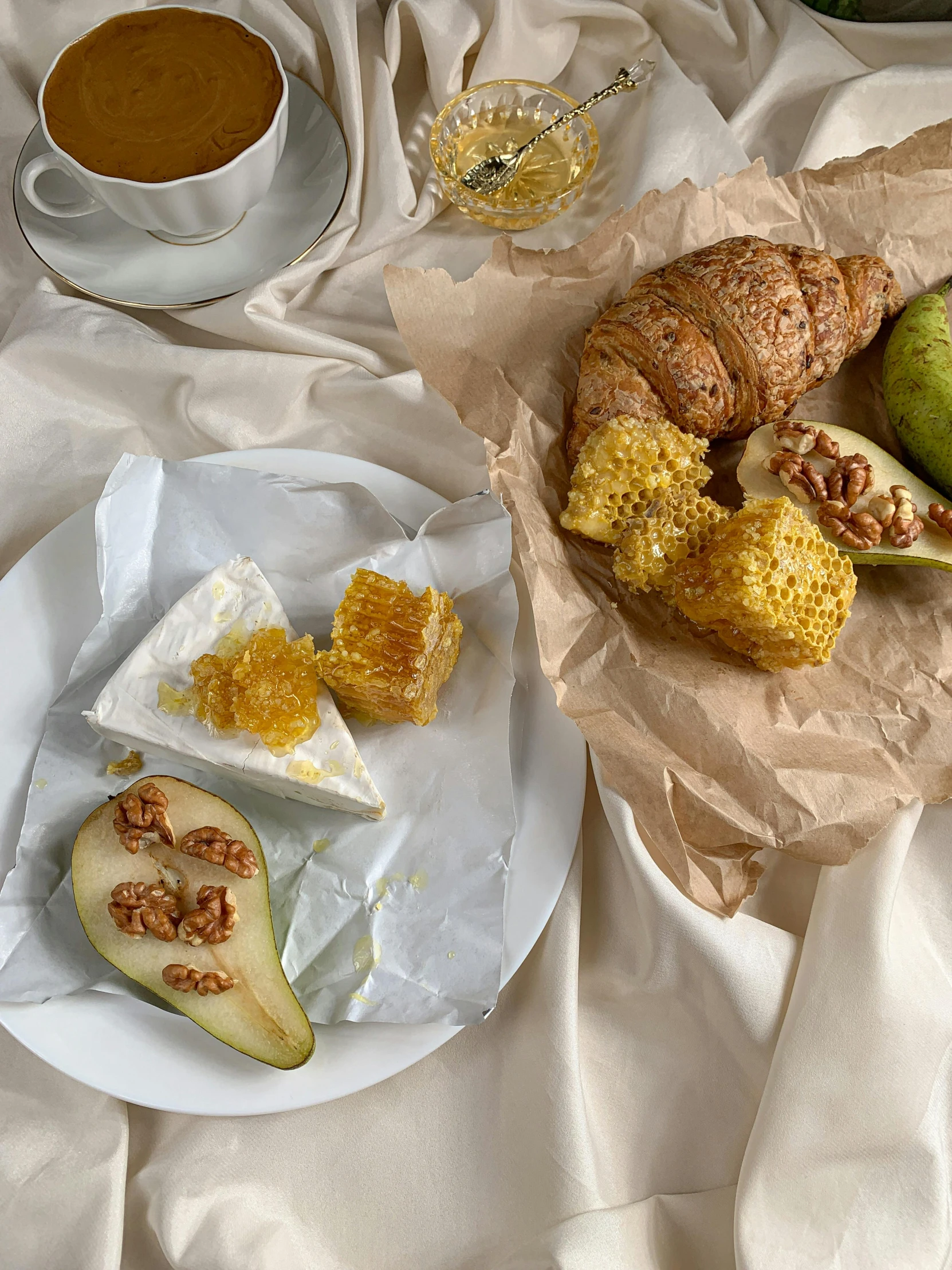 a table topped with a plate of food next to a cup of coffee, honey, 5k, cheese, pear