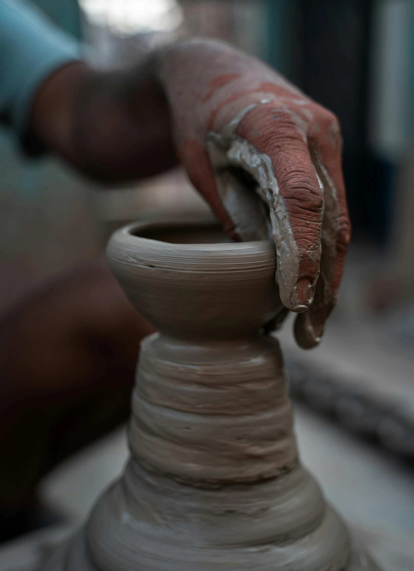 a person is making a vase out of clay, inspired by Hendrik Gerritsz Pot, trending on unsplash, paul barson, islamic, promo image