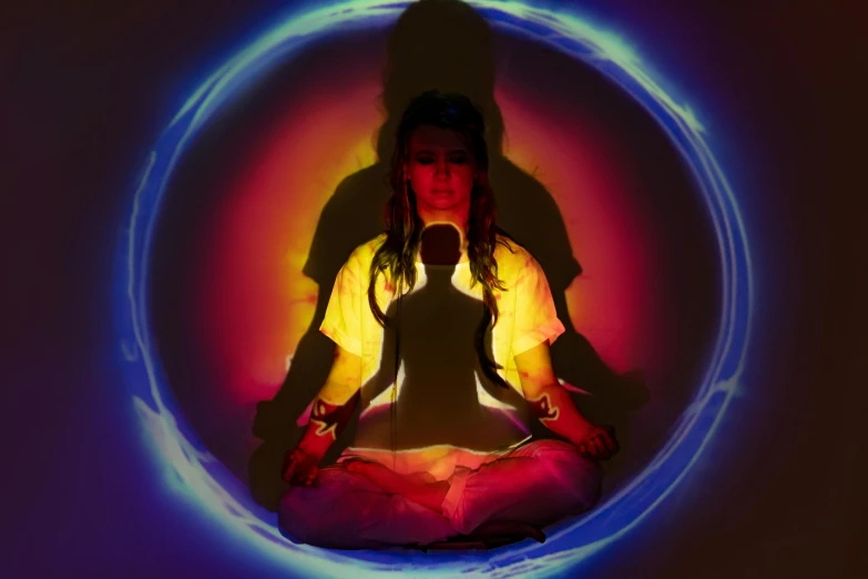 a woman sitting in the middle of a circle, a hologram, inspired by David LaChapelle, unsplash, light and space, kundalini energy, made of glowing oil, press shot, illuminated