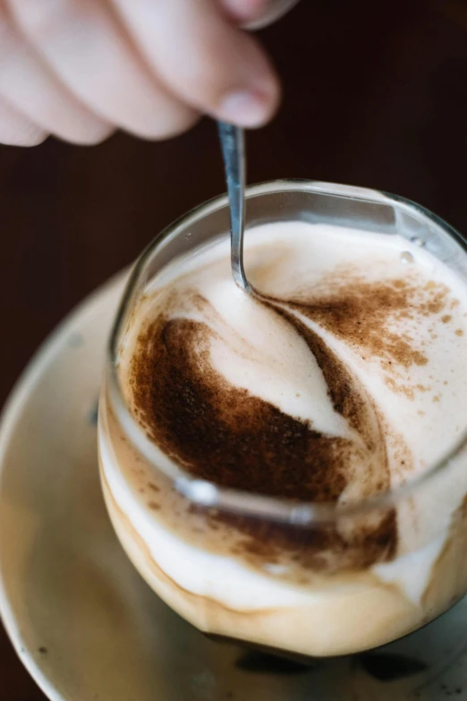 a cup of coffee with a spoon in it, a portrait, trending on pexels, vanilla smoothie explosion, aussie baristas, thumbnail, high angle close up shot