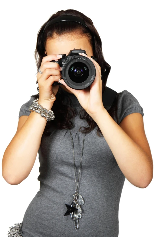a woman taking a picture with a camera, body and headshot, holding it out to the camera, information, grey