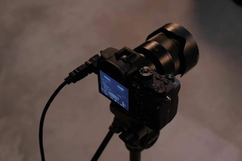 a close up of a camera on a tripod, by Niels Lergaard, unsplash, video art, very soft diffuse lights, sony a7, turned back to camera, various posed