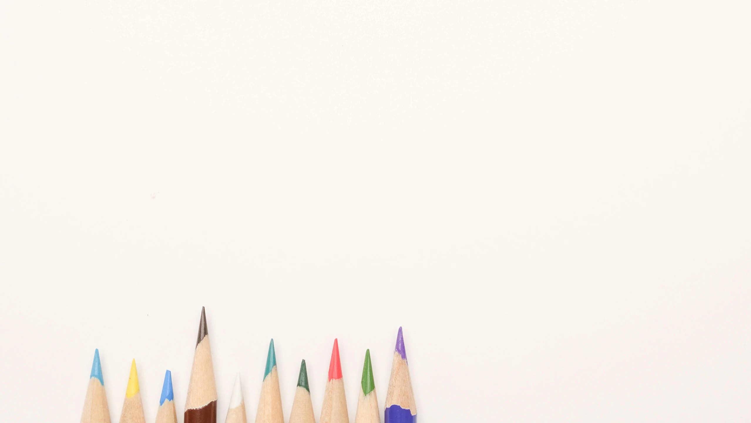 a group of colored pencils sitting next to each other, a minimalist painting, background image, white background”, !pencil, gradient brown to white