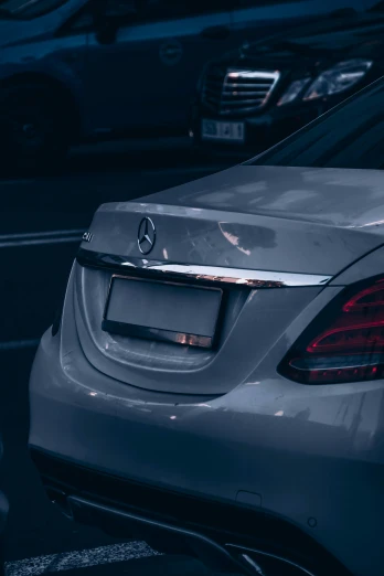 a silver mercedes parked in a parking lot, pexels contest winner, rear lighting, glossy surface, thumbnail, inspect in inventory image