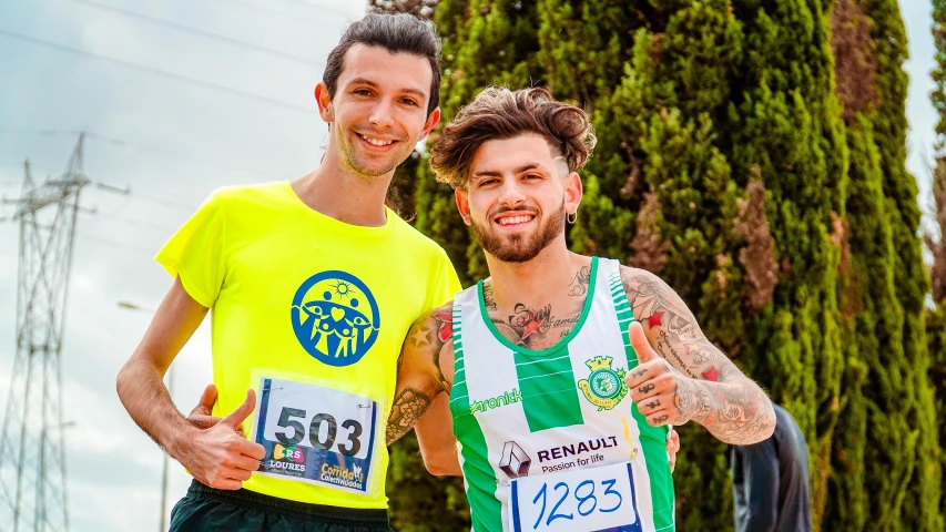 a couple of men standing next to each other, a photo, by Francesco Furini, in a race competition, yellow and green scheme, avatar image, cute photo