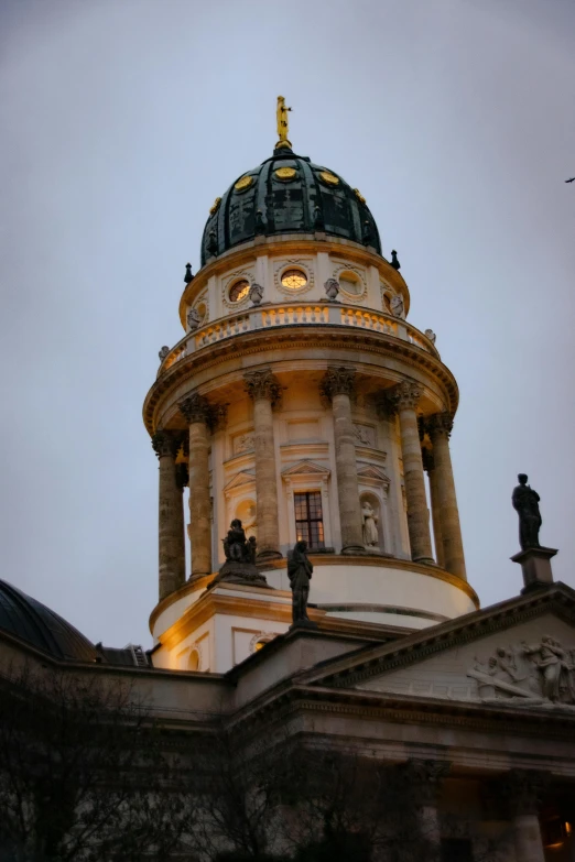 a large building with a clock on top of it, inspired by Adolf Hölzel, dome, evening lighting, profile image