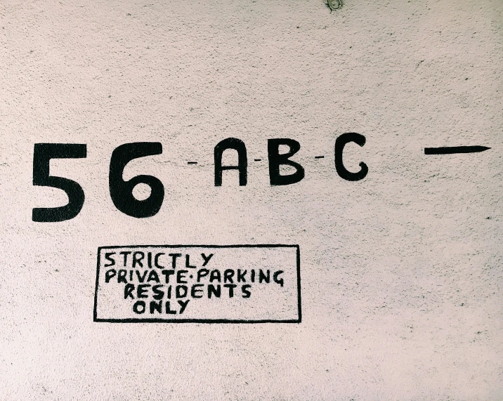 a street sign on the side of a building, by Ian Hamilton Finlay, triple six, parking in the street, illustration », abcdefghijklmnopqrstuvwxyz