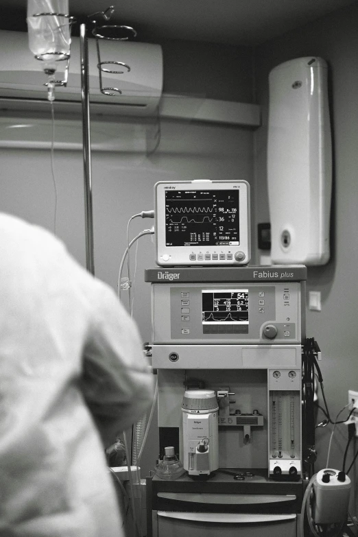 a black and white photo of a hospital room, a black and white photo, happening, connected to heart machines, background image, instagram picture, doctor