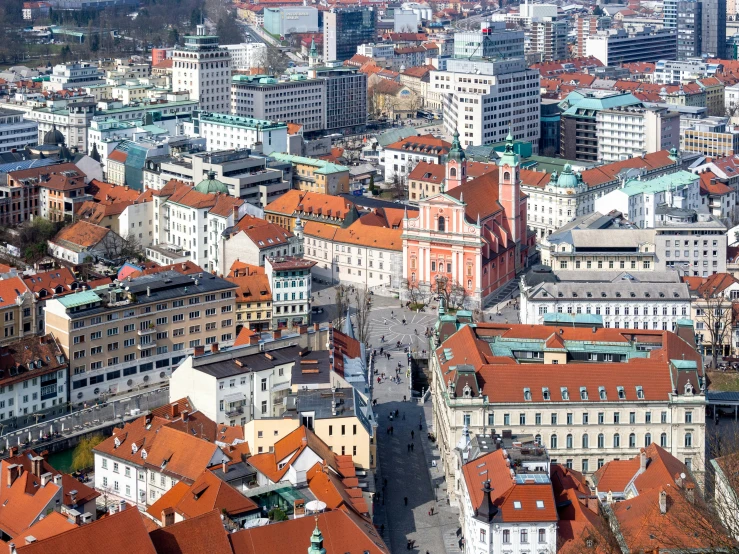 a view of a city from the top of a building, by Emma Andijewska, pexels contest winner, square, slovenian, bright sunny day, 4k -