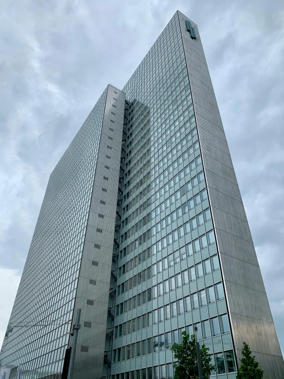 a very tall building with a lot of windows, an album cover, by Sven Erixson, unsplash, brutalism, un meeting at the hague, hyperdetailed!, view from front, completely new