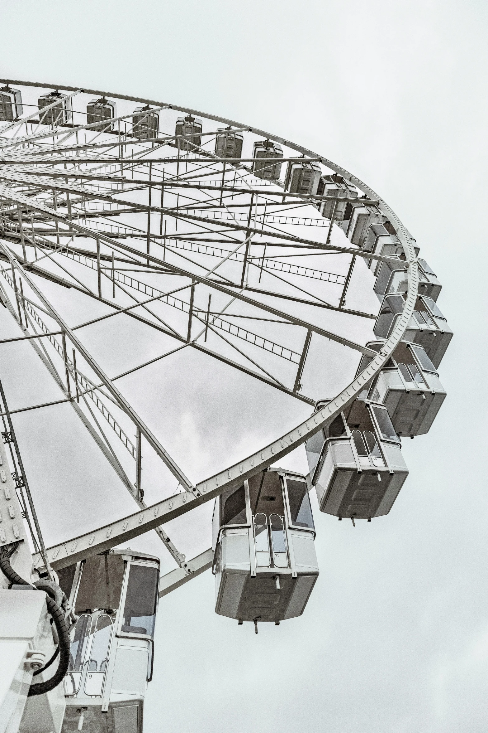 a large ferris wheel on a cloudy day, looking downwards, 2022 photograph, photographs, extra detail