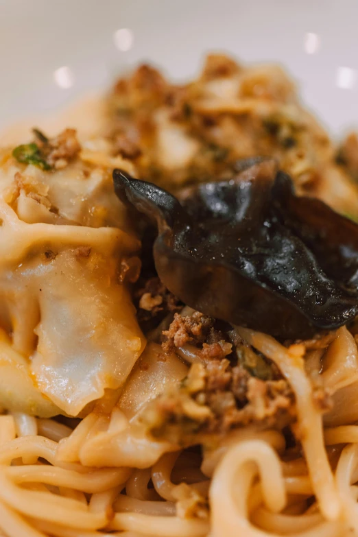 a close up of a plate of food on a table, noodles, jaya su berg, square, manhattan