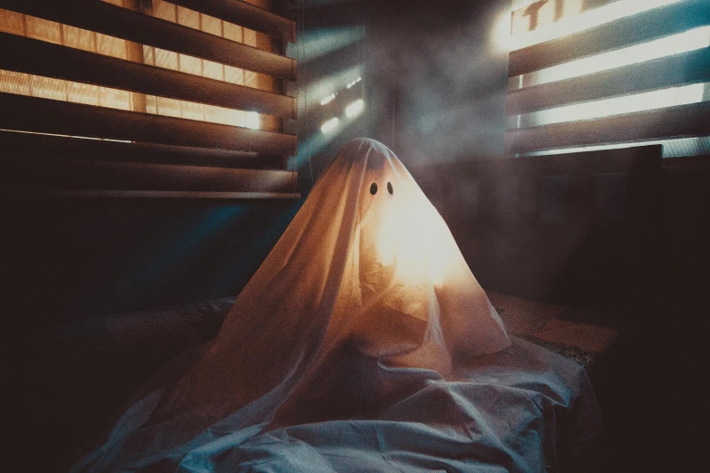 a ghost sitting on a bed in front of a window, pexels contest winner, costume, lights beaming out of eyes, blank, mr beast