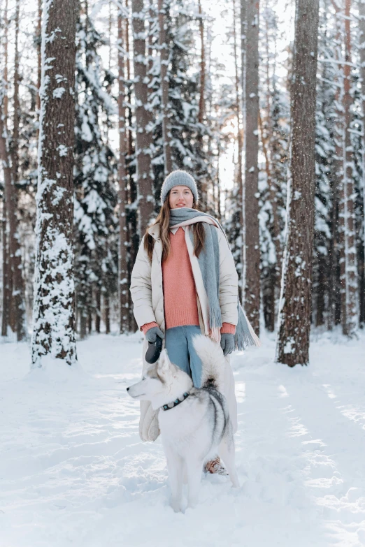 a woman walking a husky dog in the snow, pexels contest winner, bright nordic forest, avatar image, wearing casual clothing, white