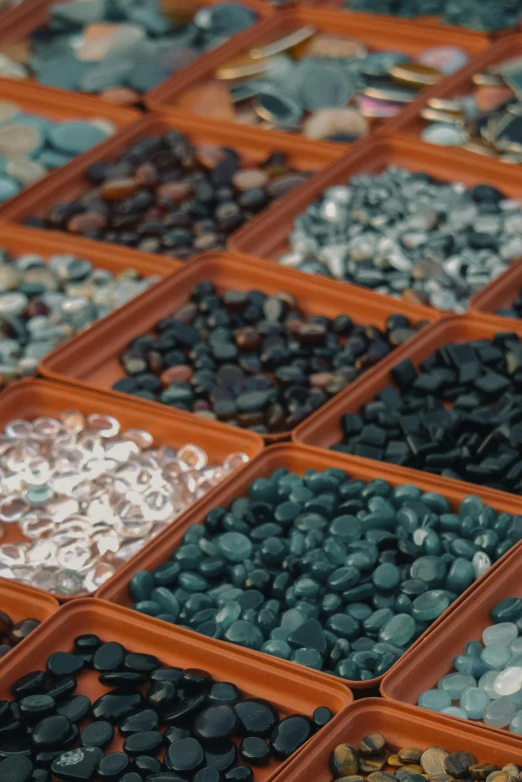 a tray filled with lots of different colored stones, by Ben Zoeller, teal palette.”, market, grid of styles, aruba