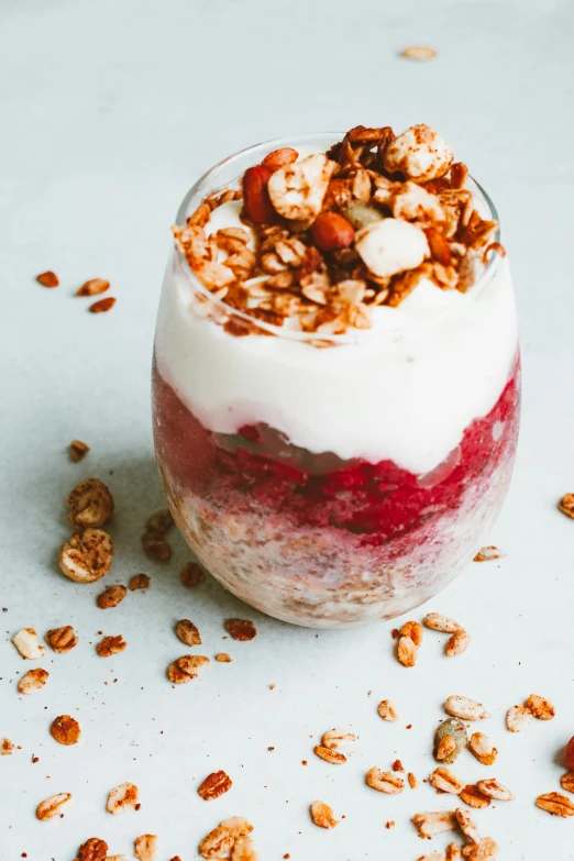 a glass filled with yogurt and granola, a portrait, trending on unsplash, raspberry banana color, white, chilean, grain”