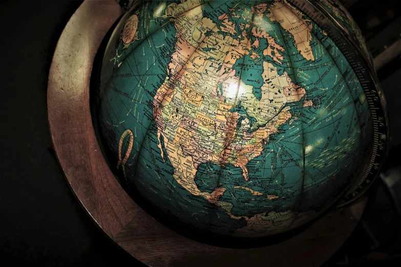 a globe sitting on top of a wooden table