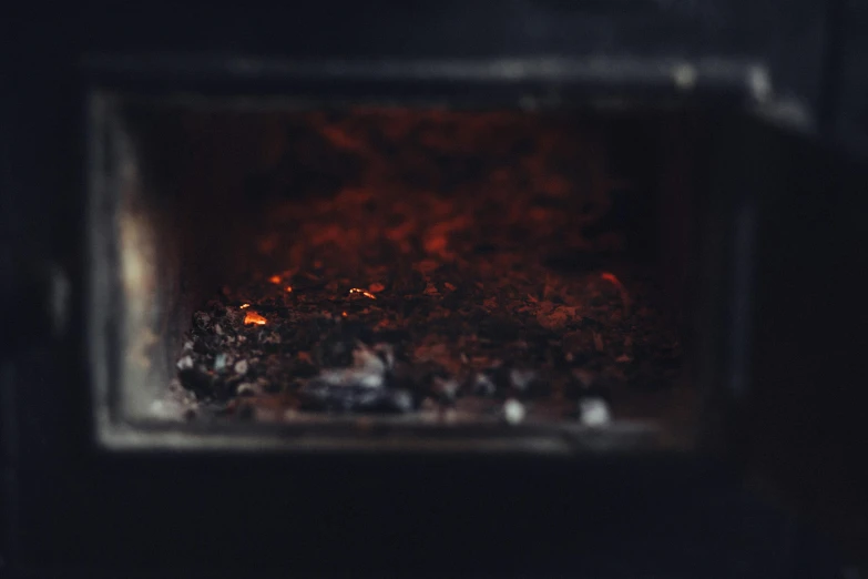 a close up of the inside of an oven, by Adam Marczyński, pexels contest winner, amalgamation of embers, analog photo, brown, instagram post