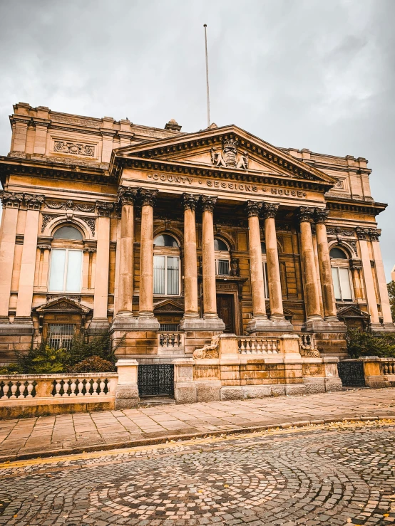 a large building sitting on top of a cobblestone street, inspired by Christopher Wren, renaissance, hull, profile image, pink marble building, grand library