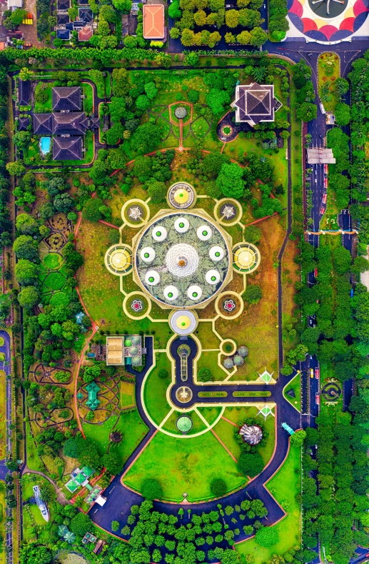 an aerial view of a park with lots of trees, by Basuki Abdullah, the grand temple of flowers, circles, panoramic shot, cosmic architecture