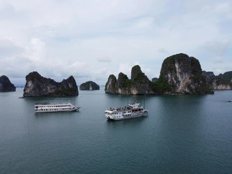 a number of boats in a body of water, pexels contest winner, vietnam, limestone, fan favorite, unedited